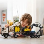 Obrázek Nákladní auto Volvo FMX a elektrický bagr Volvo EC230